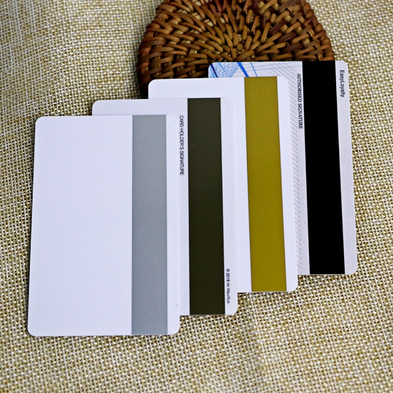 white plastic card with silver magnetic stripe